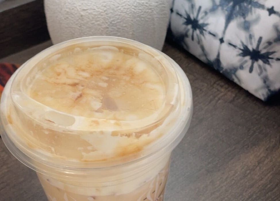 A serene decor setup with a drink at Flawless Finish Salon, Otisville, NY.