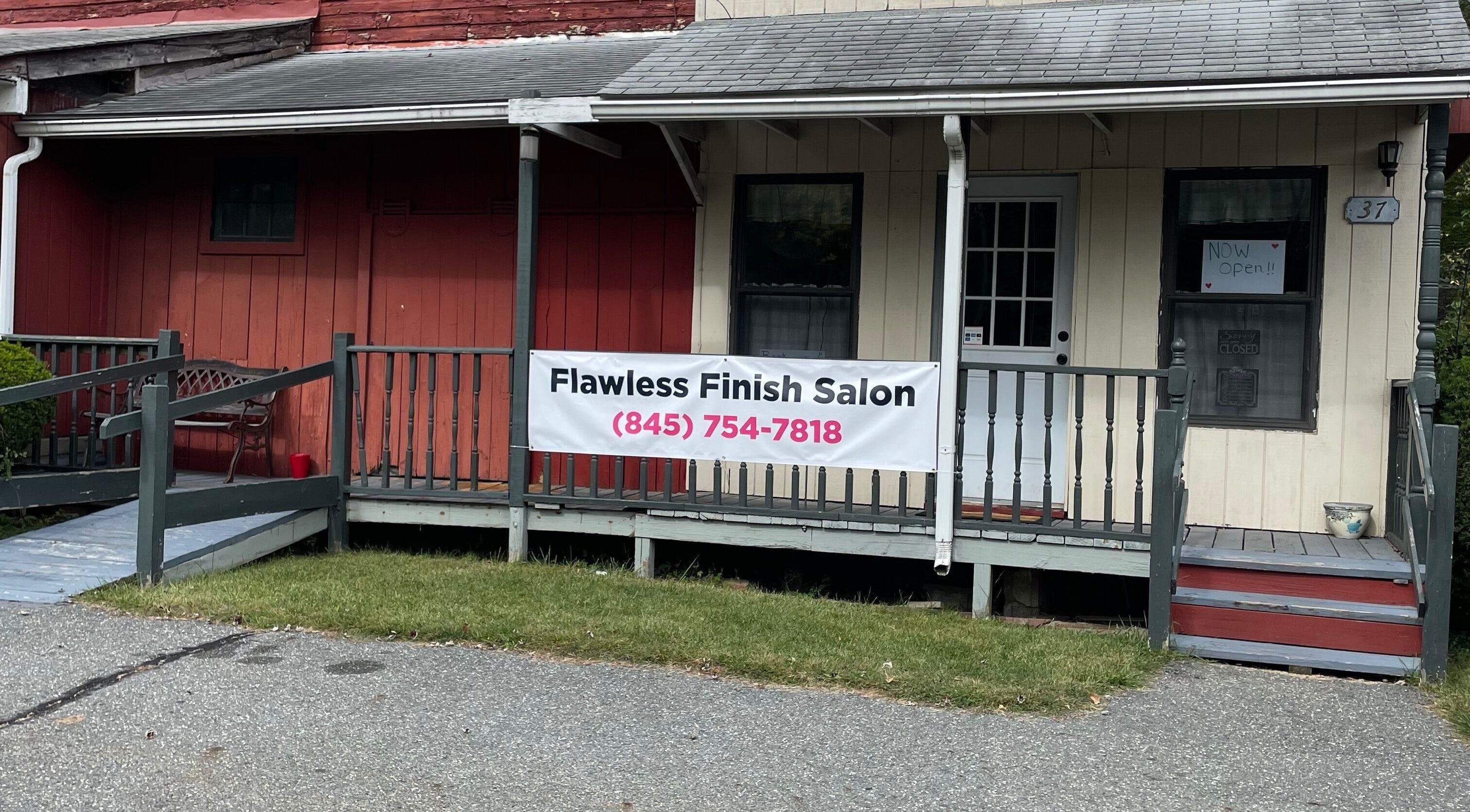 Exterior view of Flawless Finish Salon in Otisville, New York, welcoming visitors with a cozy porch.
