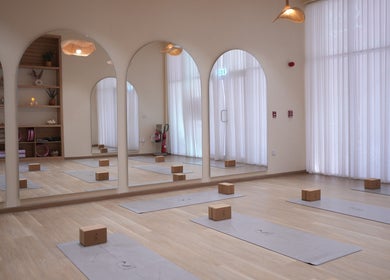 Yoga studio at Reed Women Beauty And Fitness Center, Abu Dhabi, AE with mats and blocks.