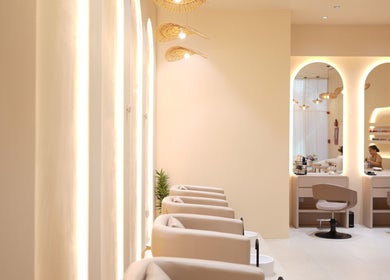 Luxury beauty space at Reed Women Beauty And Fitness Center, Abu Dhabi, AE featuring elegant seating and mirrors.