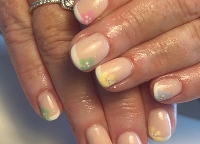 Floral French manicure at NailsbyMichaela, Plymouth, England, GB. Elegant design with pastel accents.