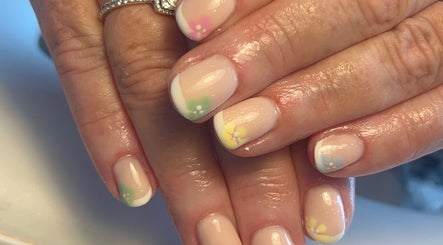 Floral French manicure at NailsbyMichaela, Plymouth, England, GB. Elegant design with pastel accents.