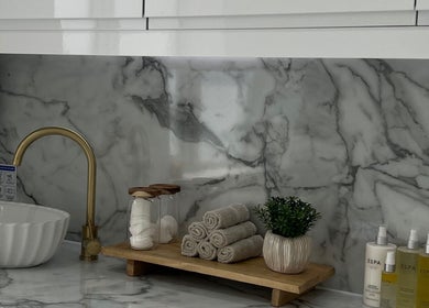 Luxurious spa setup at Sacred Skin and Wellness, Kingsteignton, England, GB with marble and gold accents.