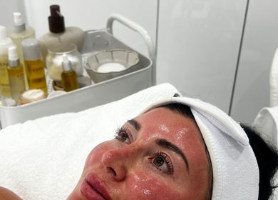 Client enjoying facial treatment at Sacred Skin and Wellness, Kingsteignton, England, GB.