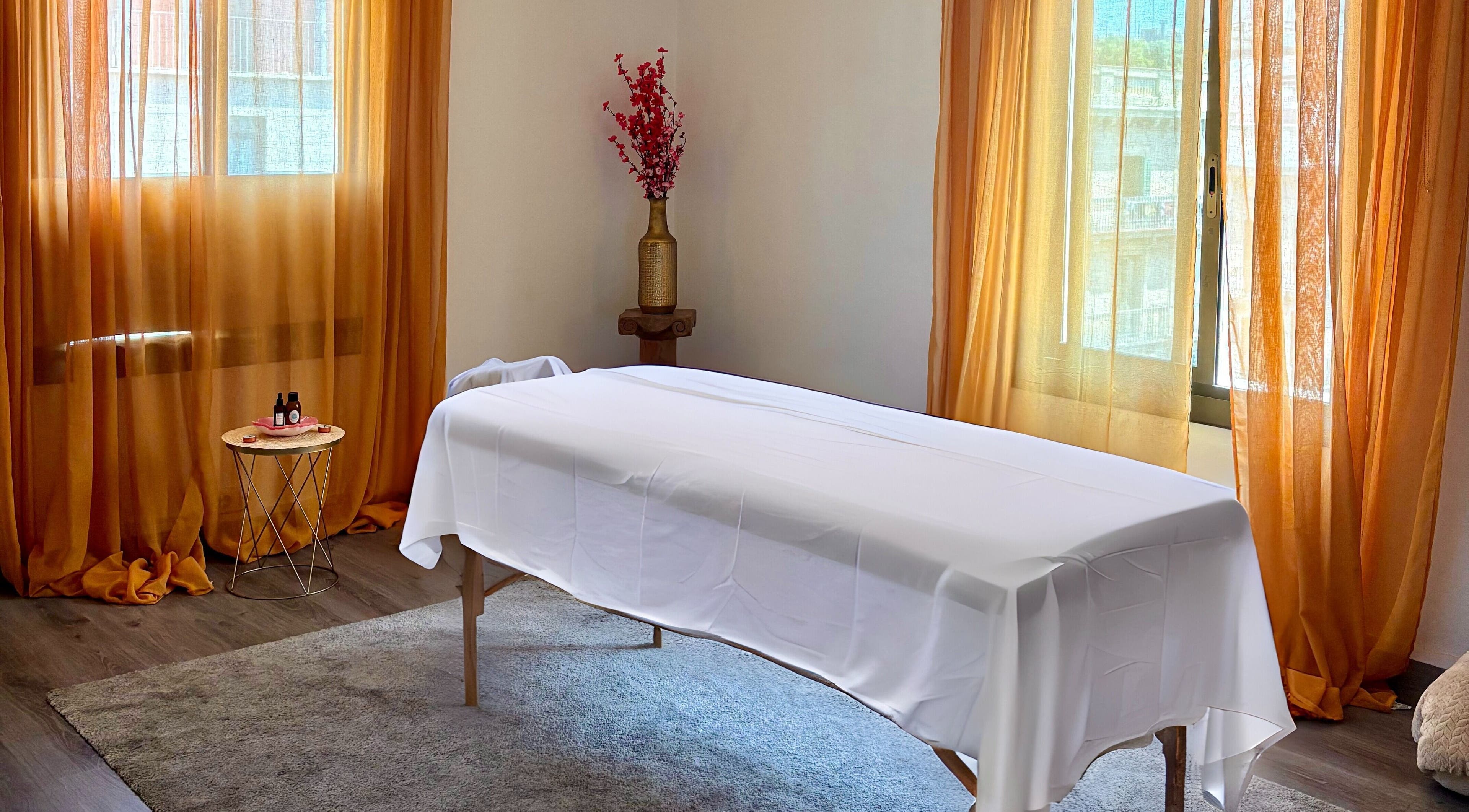 Tranquil massage room at Heaven Massage Barcelona with table, decor, and soft lighting in Barcelona, Catalunya, ES.