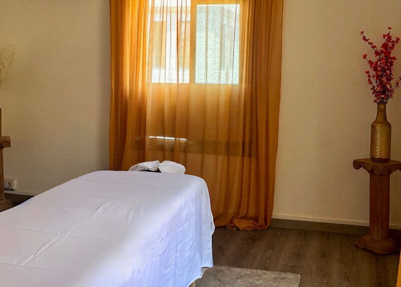 Tranquil massage room with warm decor at Heaven Massage Barcelona, located in Barcelona, Catalunya, ES.