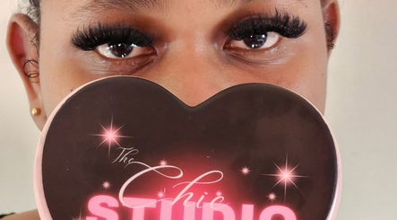 Close-up of a woman's eyes with Chic Studio mirror in Canefield, Saint Paul Parish, DM.
