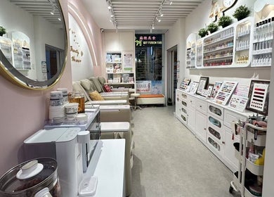 Chic interior of Seasonly Beauty Care in Singapore, SG, displaying nail care products and cozy seating.