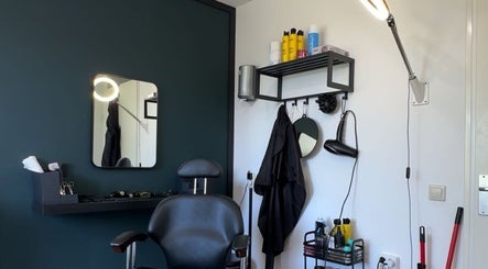 Modern salon interior with styling chair at Fjay Cuts, Ijsselstein, Utrecht, NL.
