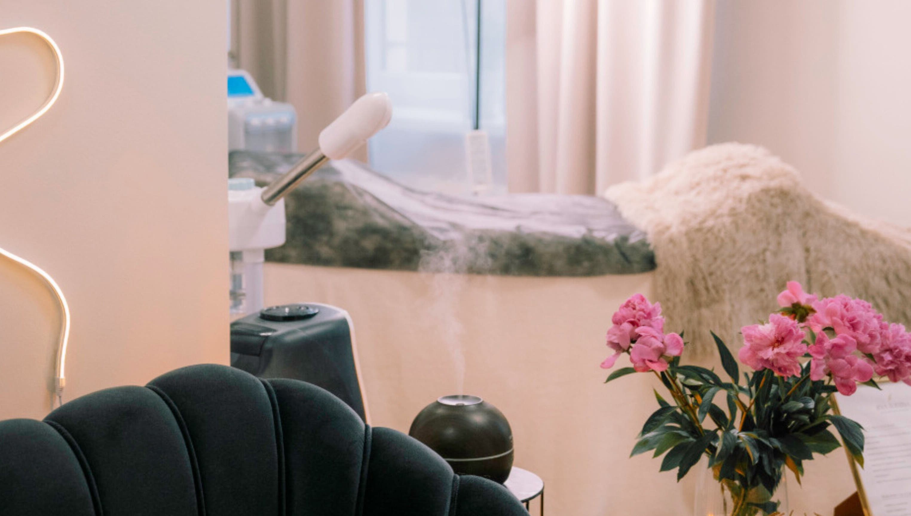Elegant beauty and wellness corner at Ernestīnes Iela 24/Rīga, Āgenskalns, featuring plush seating and floral decor. Rīga, LV