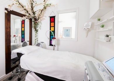 Tranquil treatment room at Gorgeous Faces By Gabriella, London, England, GB, with floral decor and modern equipment.