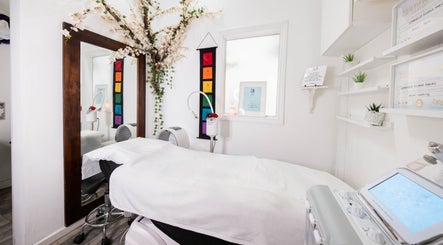 Tranquil treatment room at Gorgeous Faces By Gabriella, London, England, GB, with floral decor and modern equipment.
