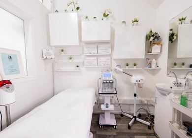 Calm treatment room at Gorgeous Faces By Gabriella in London, England, GB, with white decor and beauty equipment.