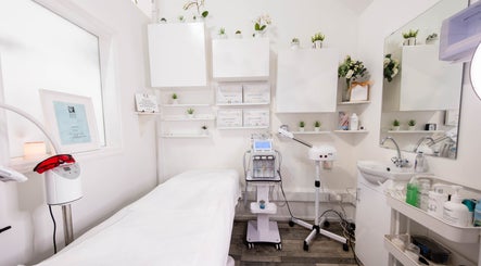 Calm treatment room at Gorgeous Faces By Gabriella in London, England, GB, with white decor and beauty equipment.