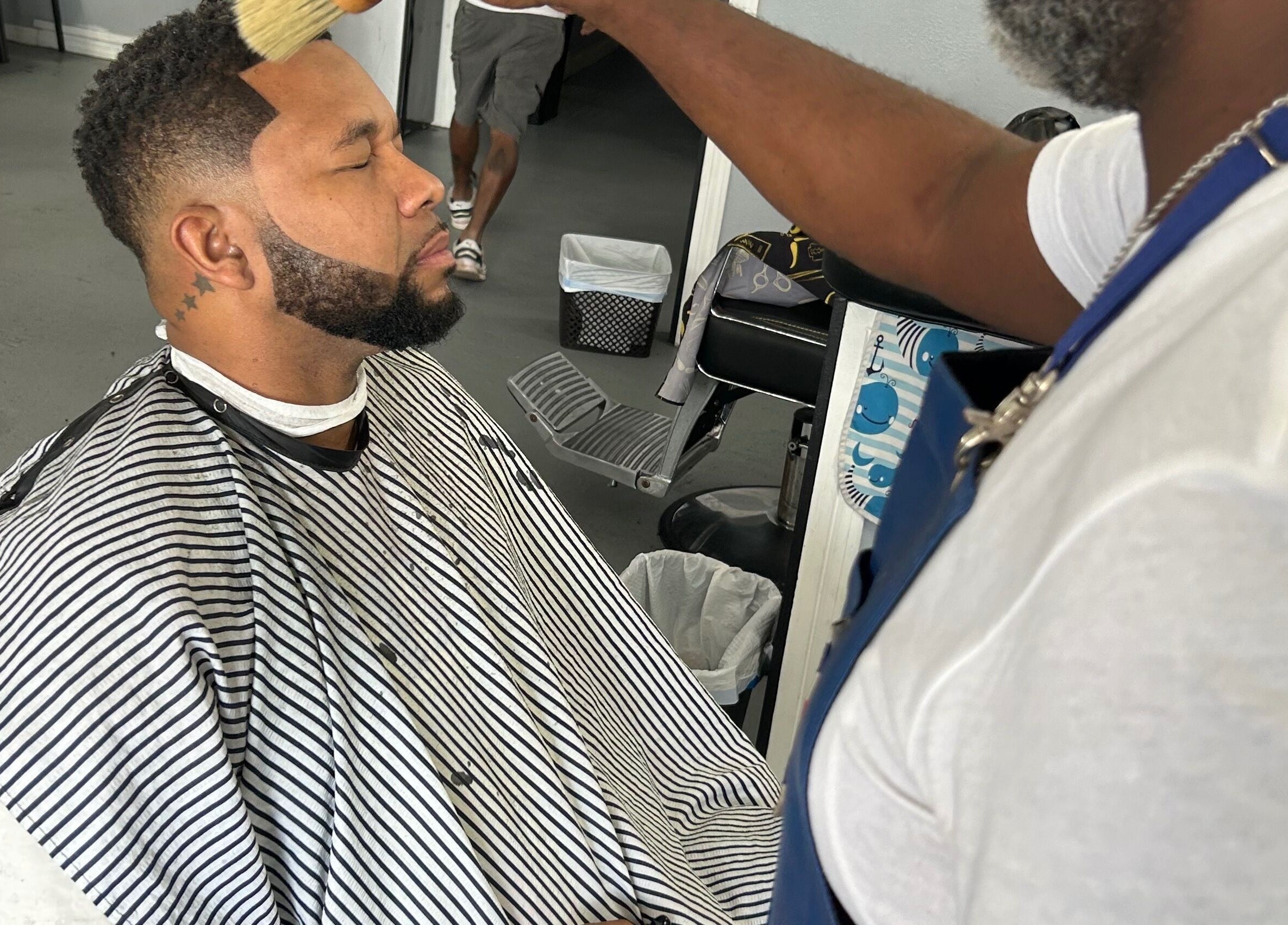 Professional haircut at Dedicated Cuts and Styles in Marrero, Louisiana, US, showcasing detailed styling.