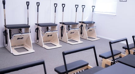 Pilates equipment at Calm And Cozy Spa, Long Branch, New Jersey, US, offering a serene workout setting.