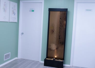 Tranquil hallway at Calm And Cozy Spa, Long Branch, New Jersey, US with decor and pilates, massage rooms.
