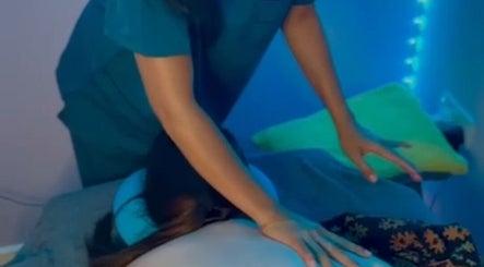 Relaxing massage session at Bali By Dee - Beauty Treatments in Colchester, England, GB with calming blue ambiance.