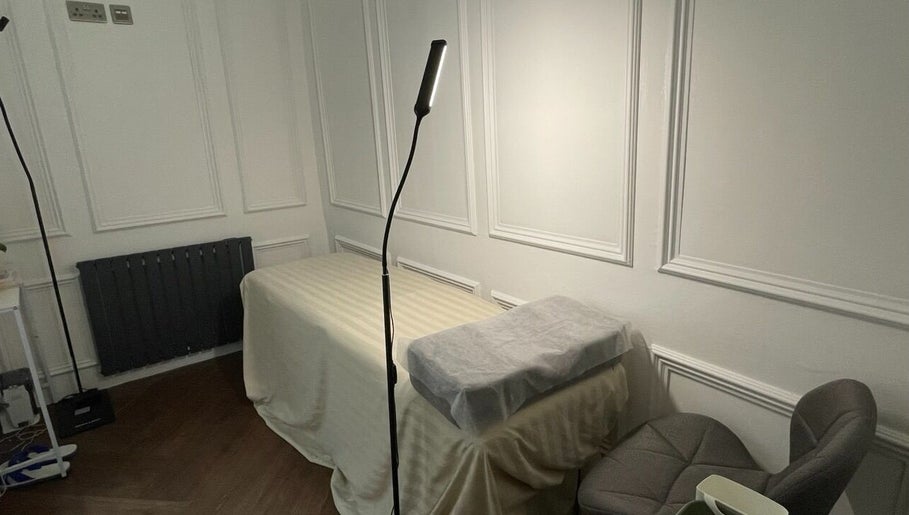 Cozy treatment bed at Eidora Eyelash in London, England, GB, offering relaxing wellness experiences.