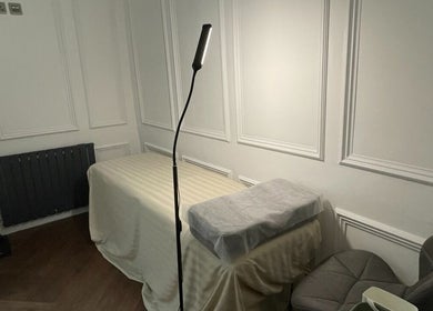 Cozy treatment bed at Eidora Eyelash in London, England, GB, offering relaxing wellness experiences.