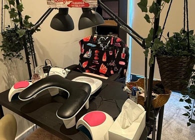 Modern nail salon station at Only Nails in Milton Keynes, England, GB, featuring sleek equipment and lush greenery.
