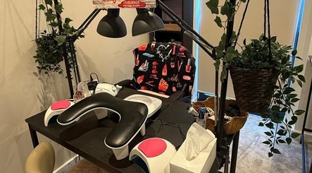 Modern nail salon station at Only Nails in Milton Keynes, England, GB, featuring sleek equipment and lush greenery.