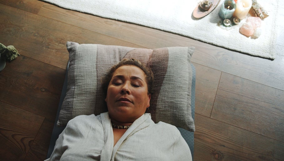 Person relaxing during a calming session at La Rosa Blanca | Reiki & Yoga in Glasgow, Scotland, GB.