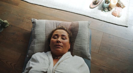 Person relaxing during a calming session at La Rosa Blanca | Reiki & Yoga in Glasgow, Scotland, GB.