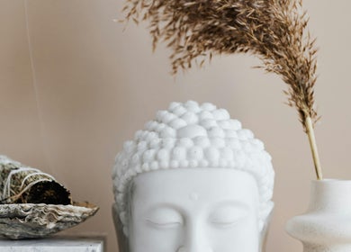 Buddha head and sage at La Rosa Blanca | Reiki & Yoga, Glasgow, Scotland, GB. Peaceful ambiance for relaxation.