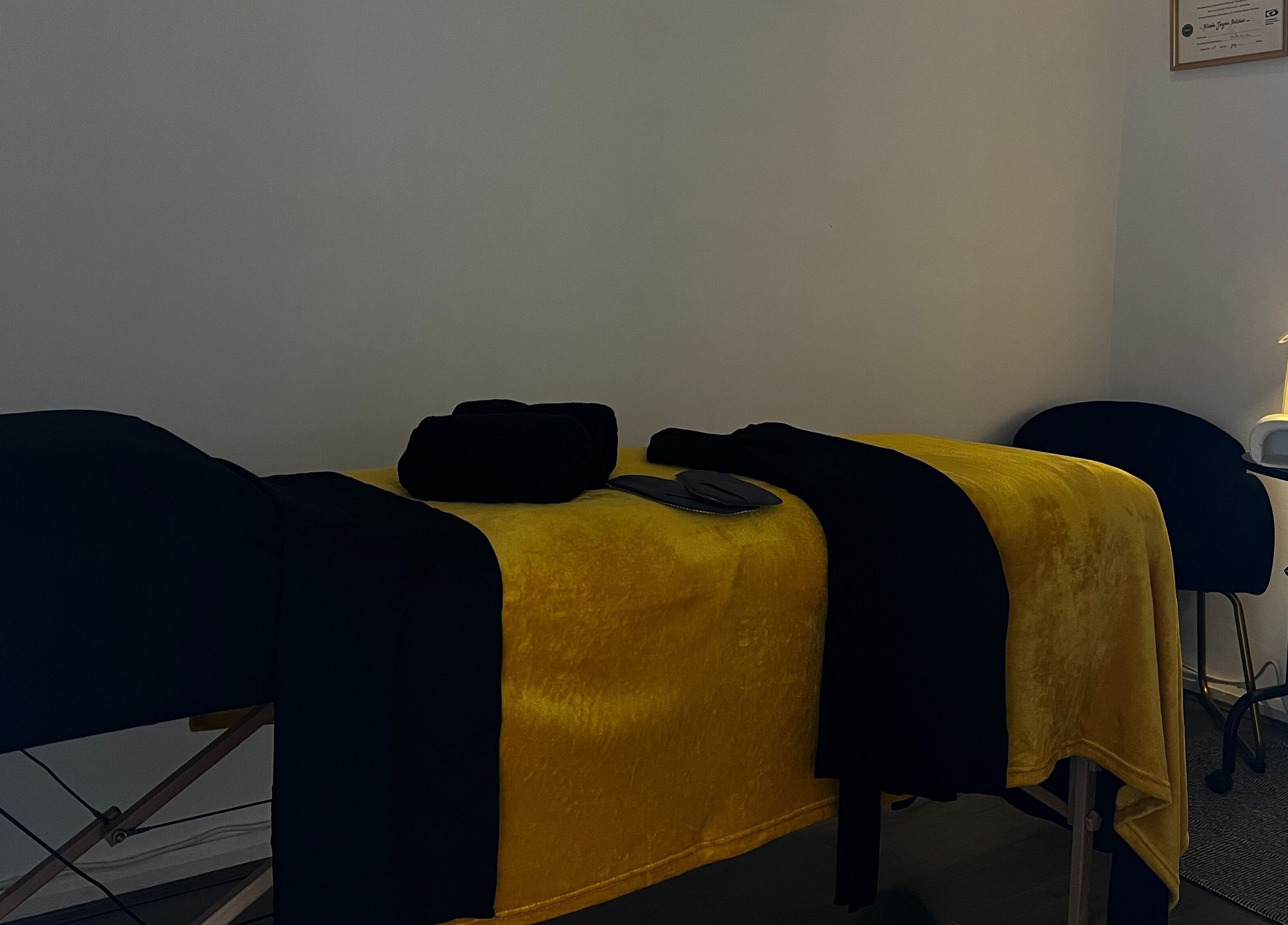 Tranquil massage room at Beauty In Simplicity, Warrington, England, GB, with a neatly set massage bed.