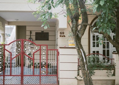 Welcoming front gate of Solo Music Lessons, Bengaluru, Karnataka, IN, surrounded by greenery.