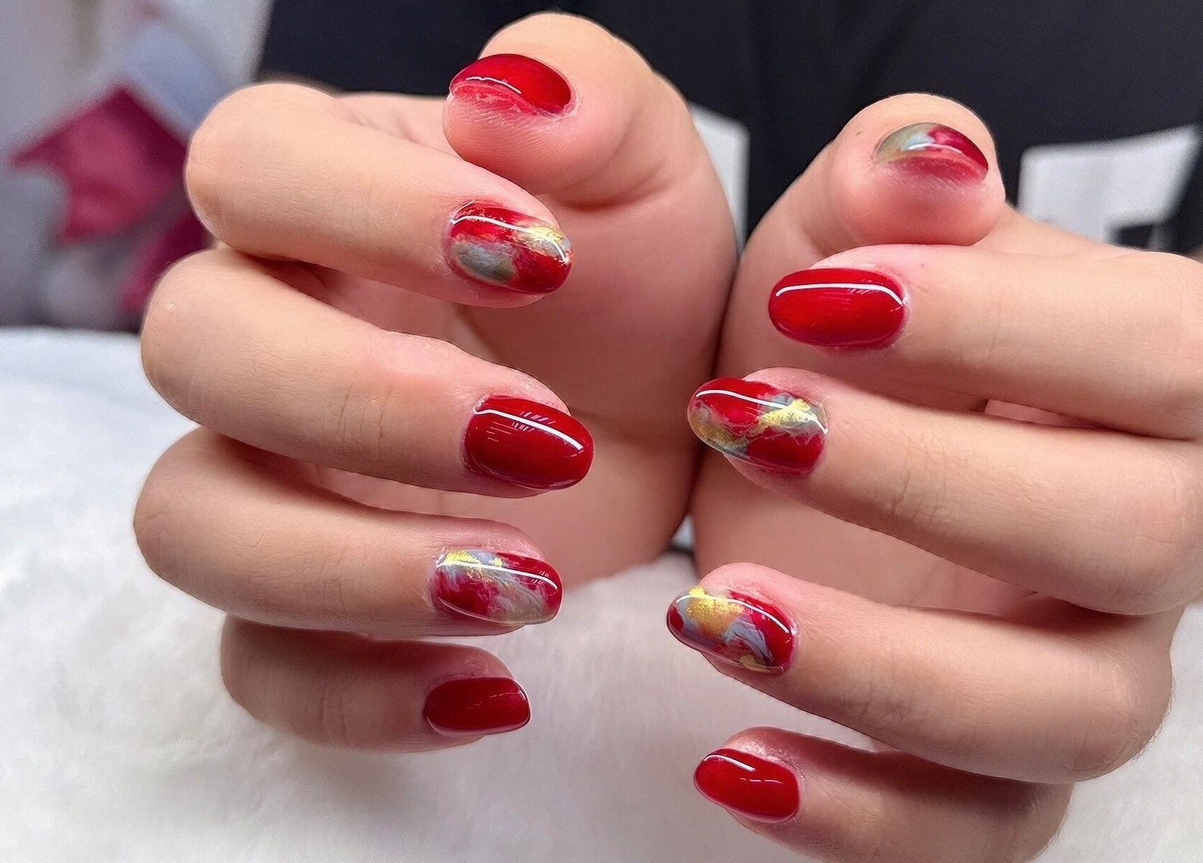 Vibrant red and marble nail art at Nails By Ting in Singapore, SG, showcasing expert craftsmanship.