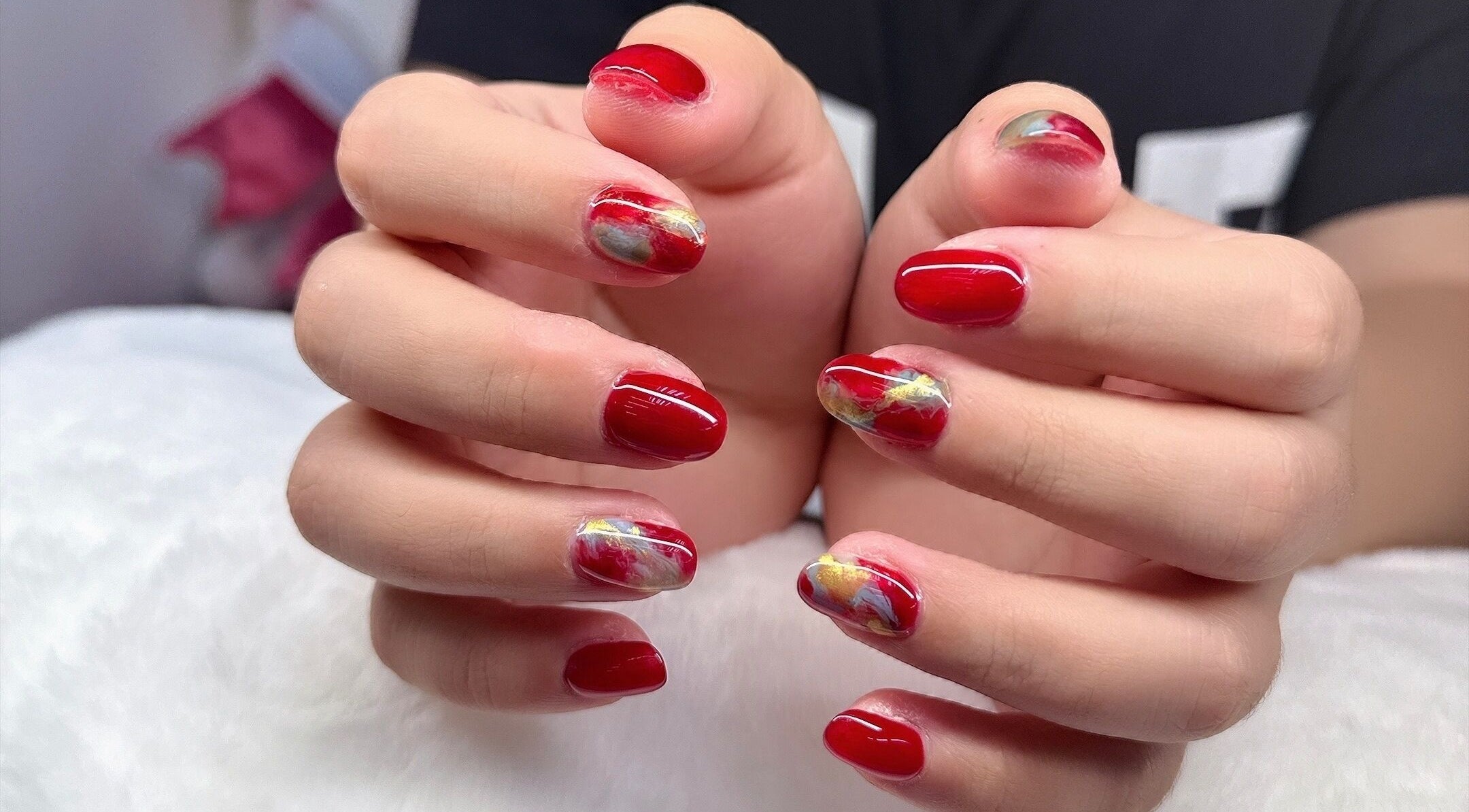 Vibrant red and marble nail art at Nails By Ting in Singapore, SG, showcasing expert craftsmanship.