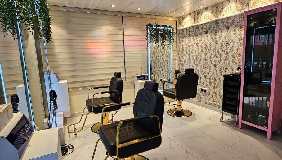 Chic interior of Renu Sachdeva Beauty Saloon in Abu Dhabi, AE showcasing stylish salon chairs and decor.