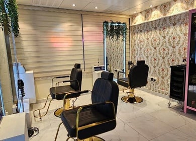 Chic interior of Renu Sachdeva Beauty Saloon in Abu Dhabi, AE showcasing stylish salon chairs and decor.