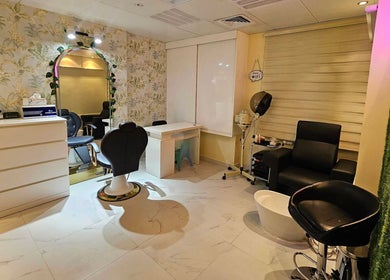 Elegant interior of Renu Sachdeva Beauty Saloon in Abu Dhabi, AE showcasing modern furnishings and stylish decor.