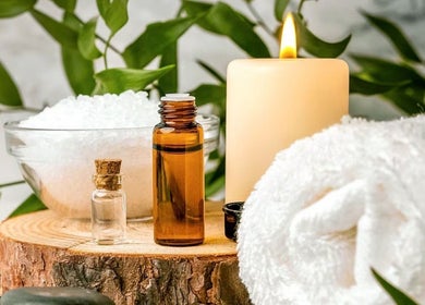 Relaxing spa setup with candle and oils at Shinrin-Yoku Spa, Bamfield, British Columbia, CA.