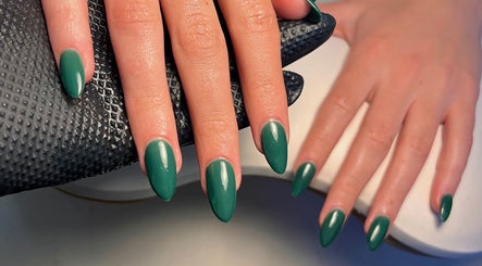 Emerald green nails at Cured. By Olivia, Cardiff, Wales, GB, showcasing elegant manicure.