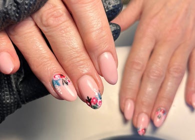 Elegant floral nail art at Cured. By Olivia, Cardiff, Wales, GB. Featuring pink nails with intricate designs.