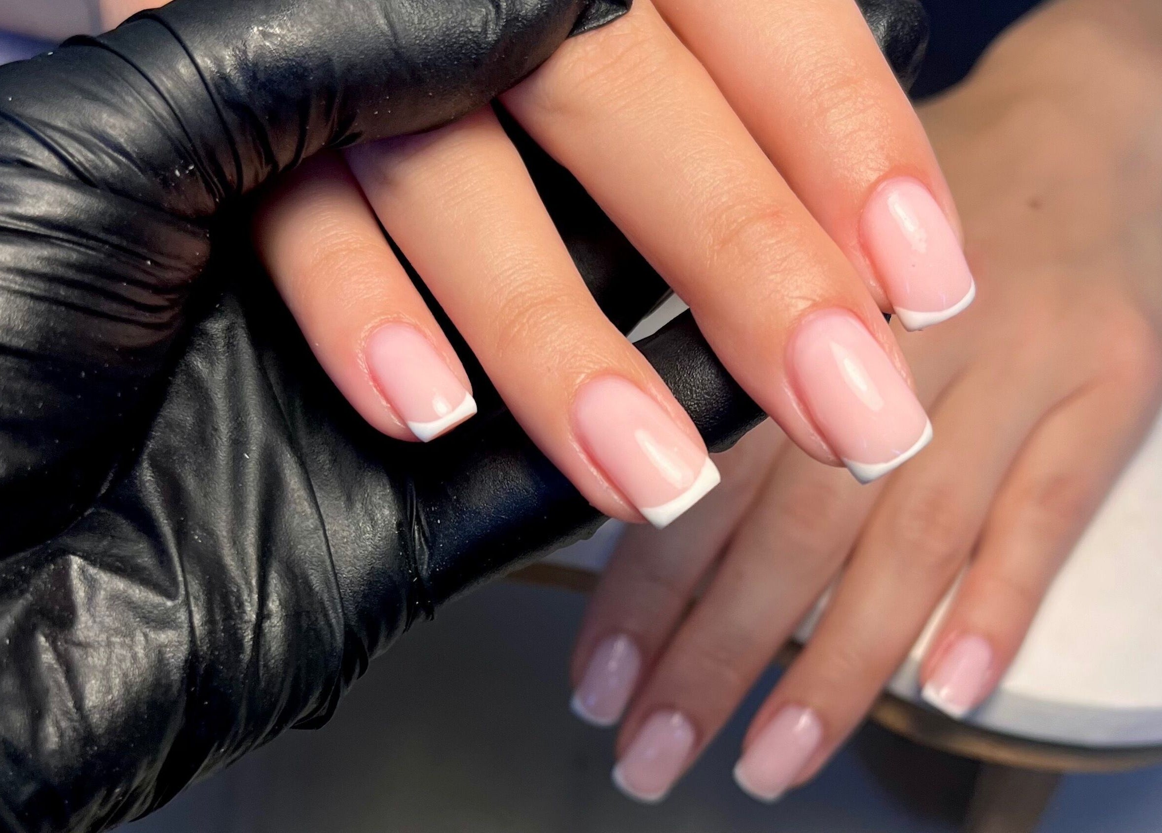 French manicure at Cured. By Olivia, Cardiff, Wales, GB. Professional nail care with polished white tips.