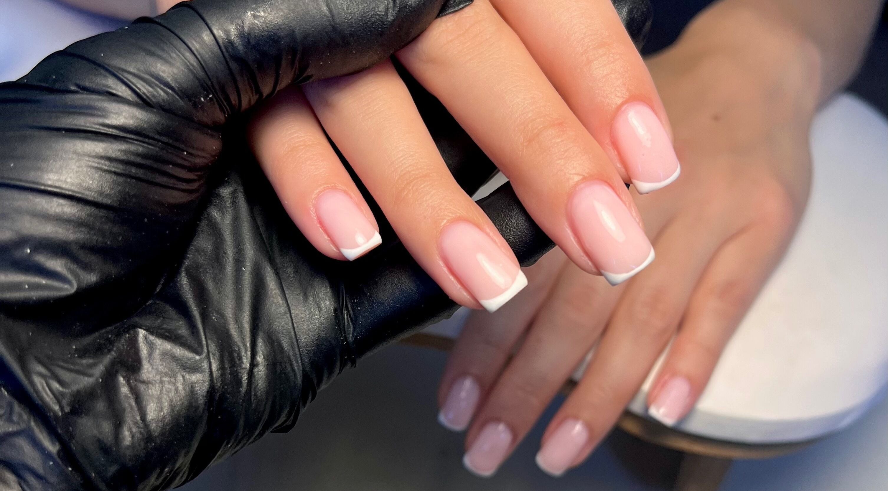 French manicure at Cured. By Olivia, Cardiff, Wales, GB. Professional nail care with polished white tips.
