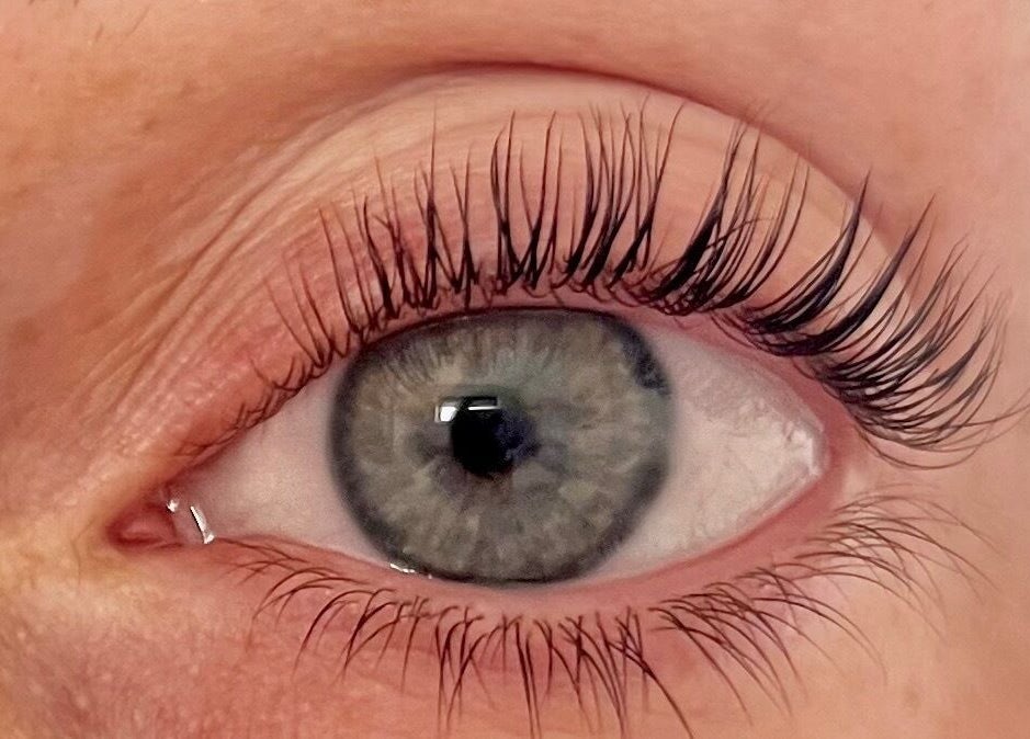 Close-up of enhanced eyelashes at Cured. By Olivia in Cardiff, Wales, GB showcasing expert beauty treatment.