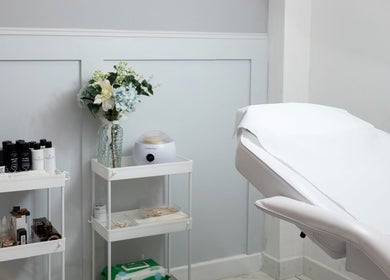 Serene treatment room at The brow studio Llanelli, Llanelli, Wales, GB, featuring comfortable spa bed and elegant decor.