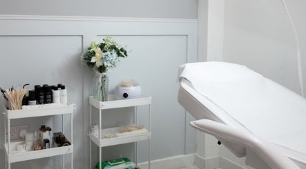 Serene treatment room at The brow studio Llanelli, Llanelli, Wales, GB, featuring comfortable spa bed and elegant decor.