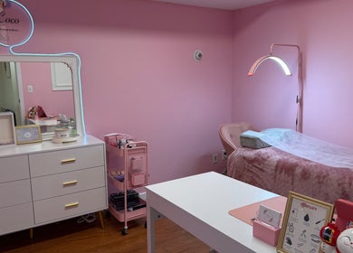Elegant pink treatment room at COCO EYELASH & BROWS.LLC, New York, New York, US, featuring a cozy setup.