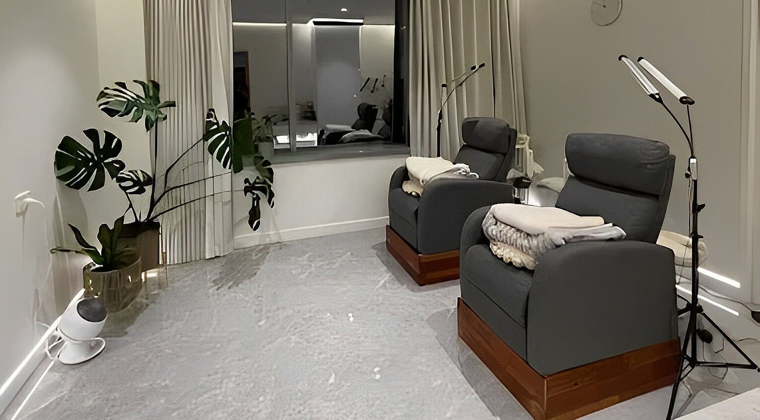 Relaxing lounge at MIU MIU EYELASHES in Sydney, New South Wales, AU with plush chairs and modern decor.