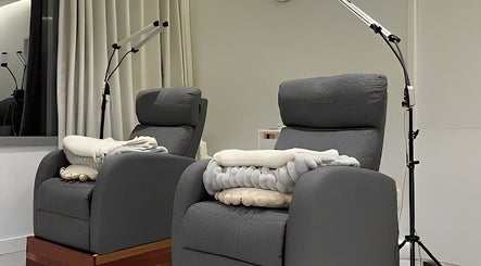 Comfortable chairs at MIU MIU EYELASHES, Sydney, New South Wales, AU for a relaxing beauty experience.