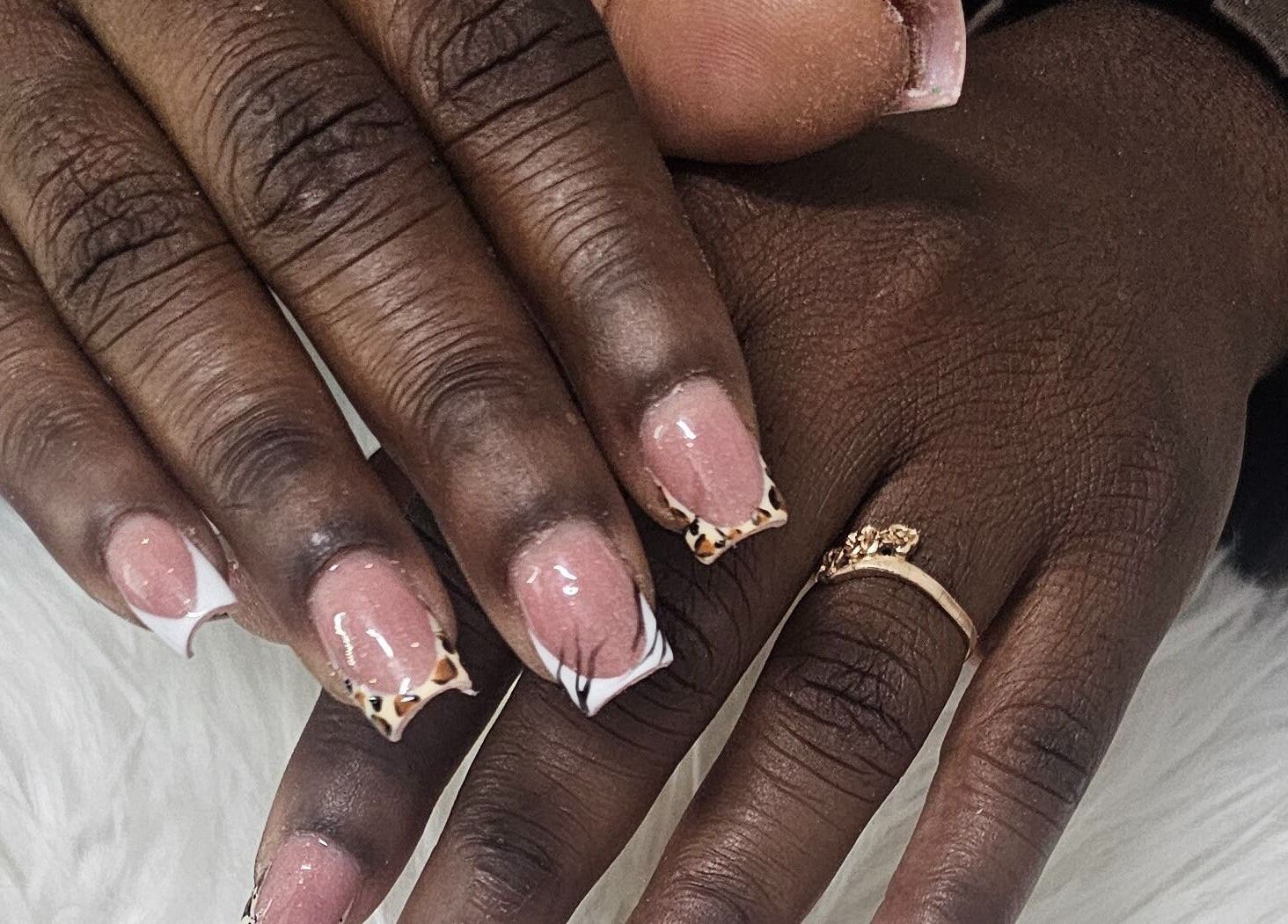 Stylish nail art with leopard tips at Get_nailed784studio, Charlotte, Charlotte, VC.