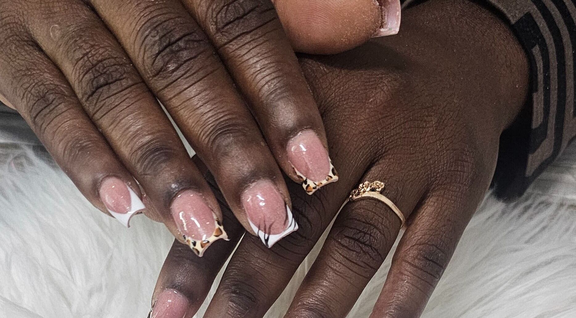 Stylish nail art with leopard tips at Get_nailed784studio, Charlotte, Charlotte, VC.