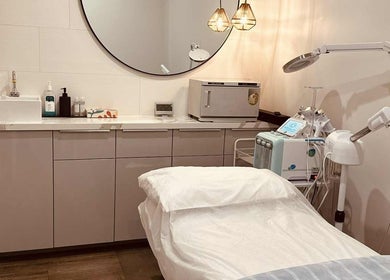 Modern treatment room at Lavina Beauty, Hampton, Victoria, AU, featuring facial equipment and a calming ambiance.